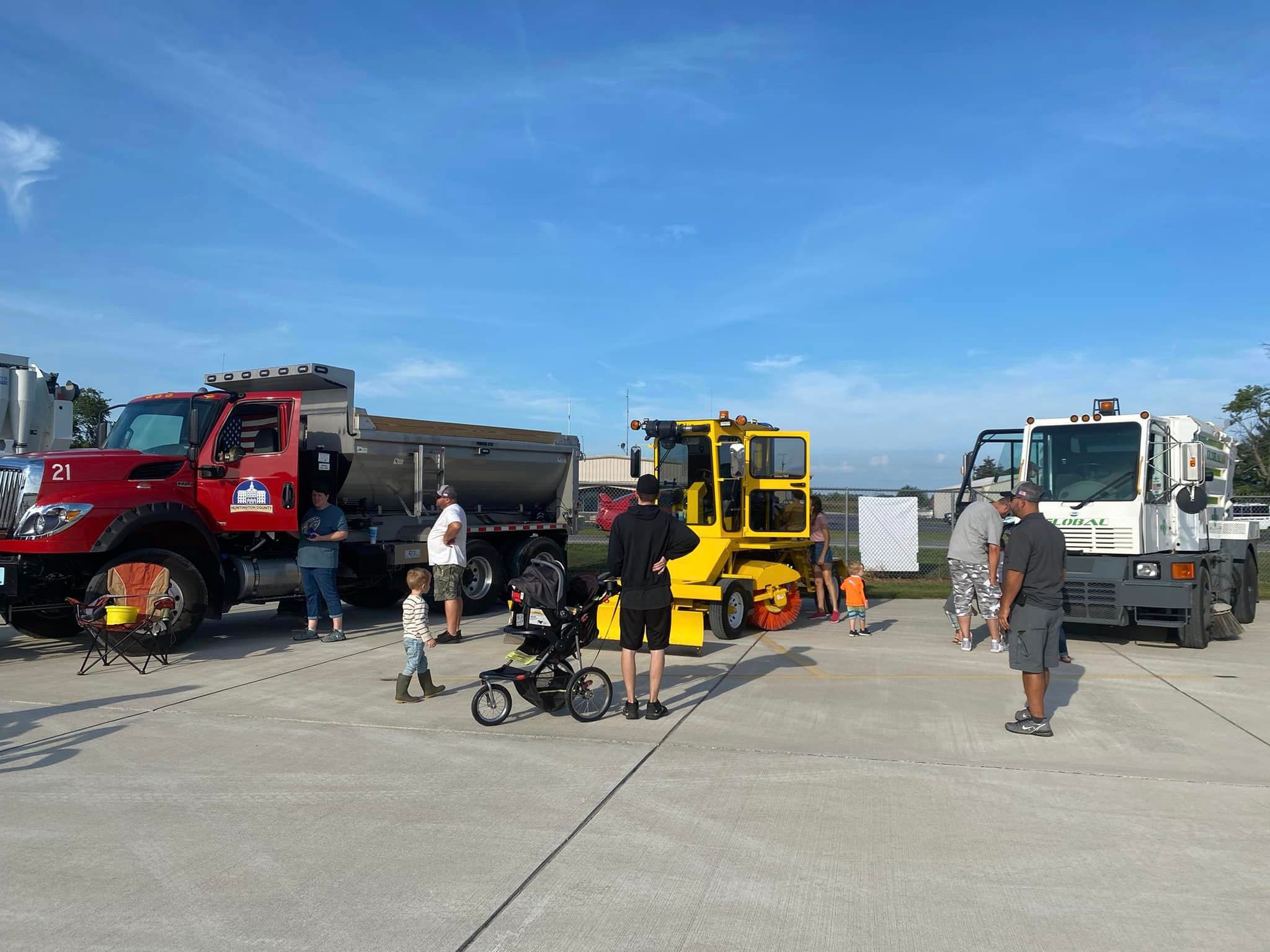 Residents take a close look at vehicles and heavy machinery in this photo taken at 2022's Touch a Truck event