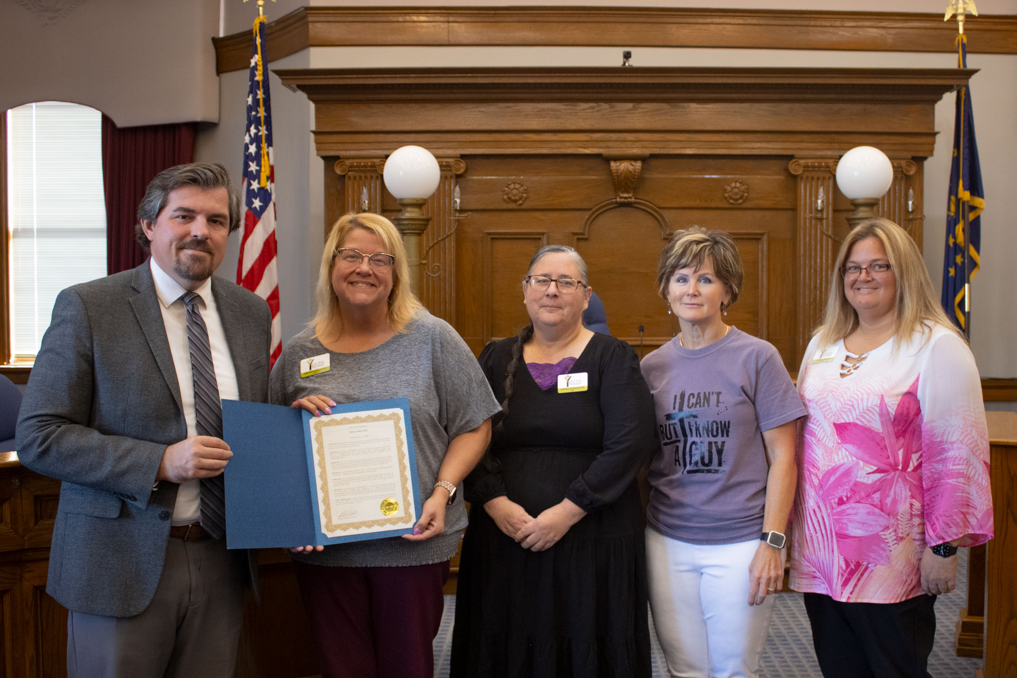 Mayor Richard Strick presents a proclamation to Youth Services Bureau staff for National Suicide Prevention Month