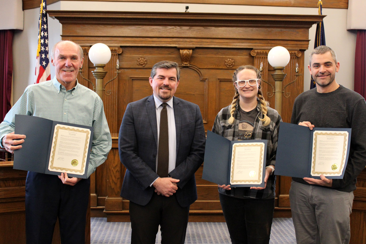 Mayor Richard Strick poses with the Chamber of Commerce's Steve Kimmel, Main Street Huntington's Sharon Metzger and the Visitor Bureau's Bobby Kemp