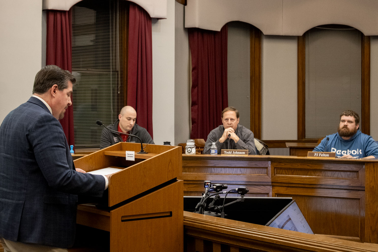 Mayor Strick speaks at a podium in City Council Chambers